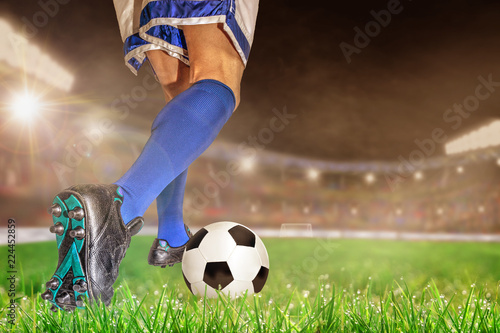 Soccer Player Dribbling FootBall in Outdoor Stadium With Copy Space