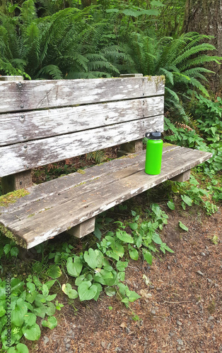Hikers water bottle on hiking trail.