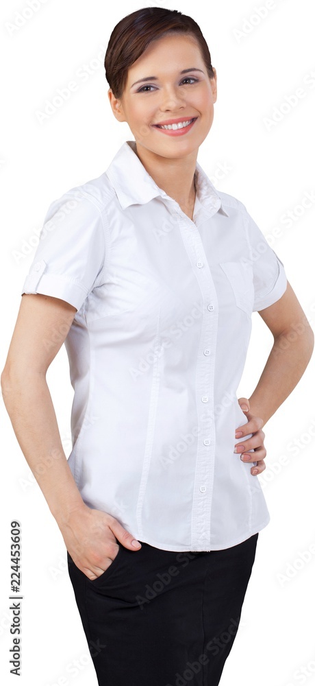 Smiling Businesswoman with Hand in Pocket and on Hip - Isolated Smiling Businesswoman with Hand in Pocket and on Hip - Isolated