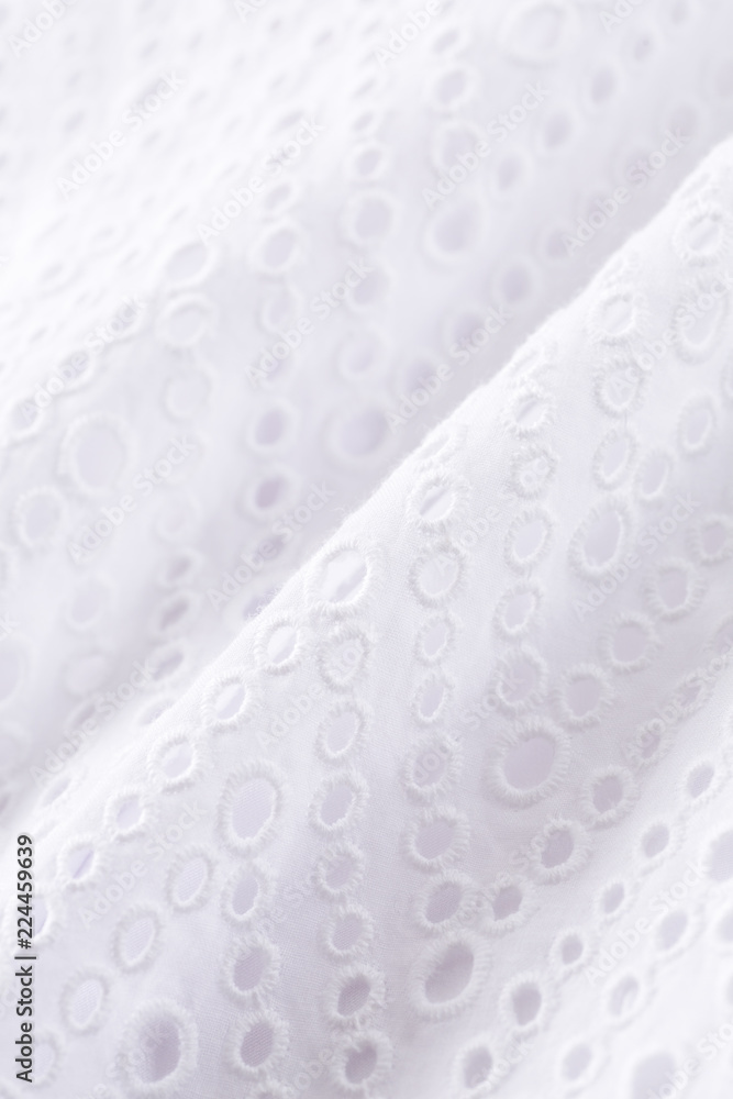 丸い穴の空いた刺繍の白い布 Stock Photo Adobe Stock