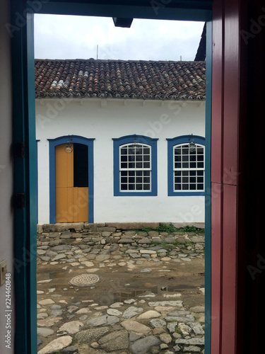 Historic house facade by the door paraty brazil photo