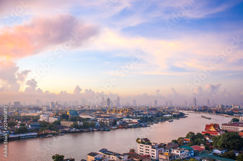 Sun rise The Chao Phraya River Behind the view of the royal palace in the corner.