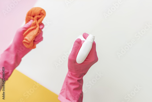 female hand in pink gloves cleaning concept on solid color background, housewokr concept f