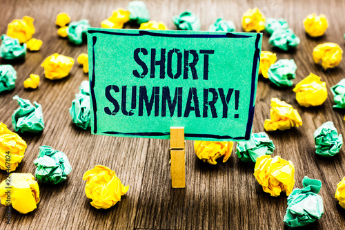 Conceptual hand writing showing Short Summary Motivational Call. Business photo showcasing Brief statement of main points clear Crumpled papers ideas mistakes paperclip clip objects wood