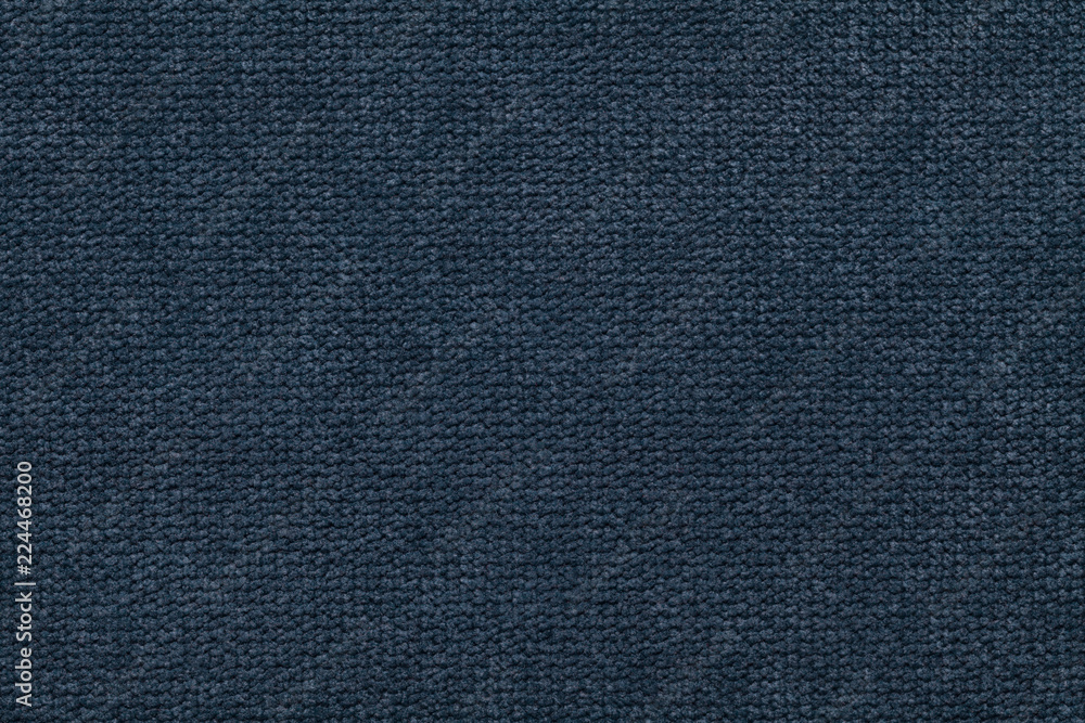 Dark blue fluffy background of soft, fleecy cloth. Texture of light nappy textile, closeup. Dark blue fluffy background of soft, fleecy cloth. Texture of light nappy textile, closeup.