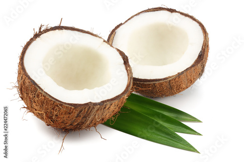 Coconut with green leaves isolated on white background