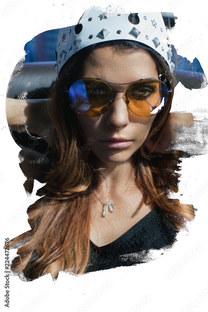 Beautiful young woman in sunglasses and a crown with in the crown indoor close-up in bolt Beautiful young woman in sunglasses and a crown with in the crown indoor close-up in bolt