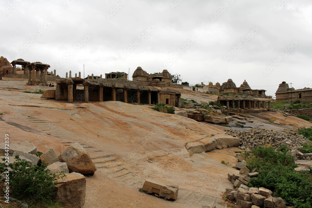 The formation of pillars, ruins, rocks, and Group Monuments of Temples in Hampi.