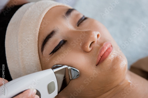 Picture of beautician doing rf procedure photo