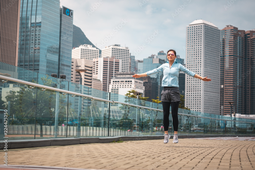 Urban woman doing workout in the city Urban woman doing workout in the city