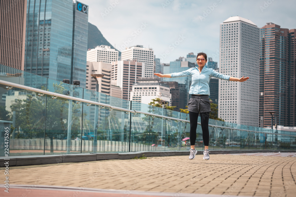 Urban woman doing workout in the city Urban woman doing workout in the city