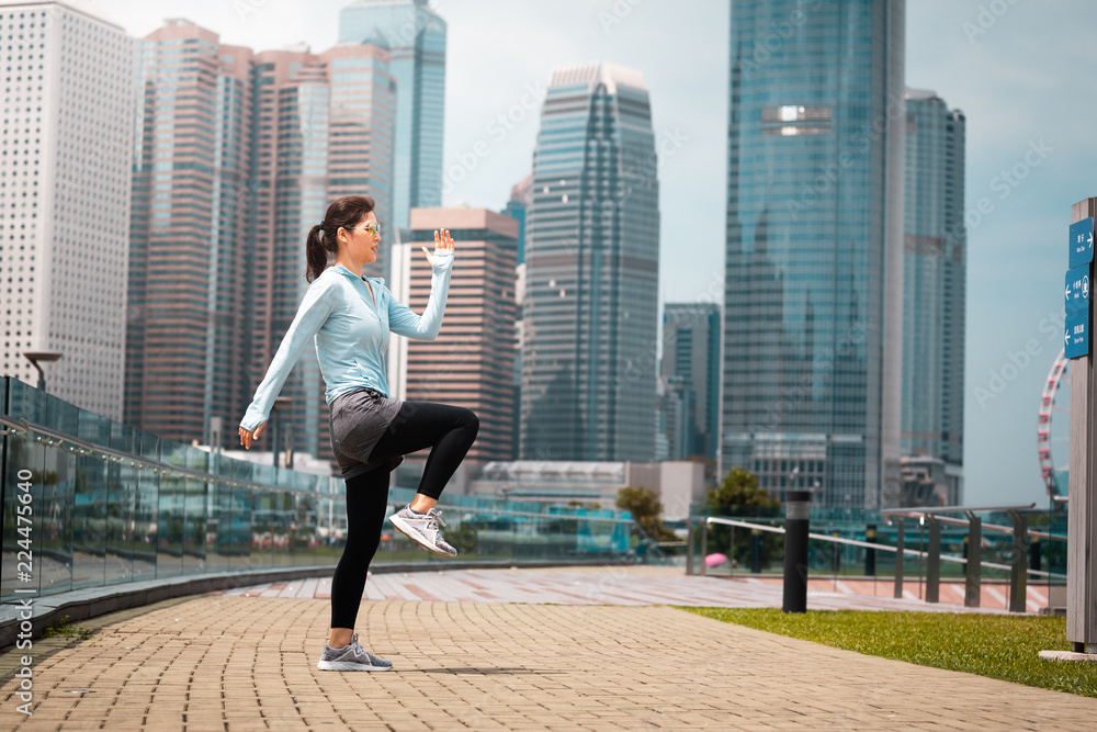 Urban woman doing workout in the city Urban woman doing workout in the city