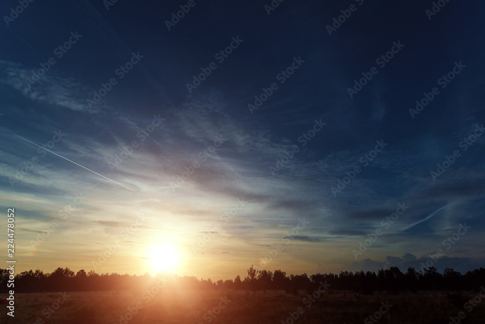 Beautiful foggy landscape, sunset. The fog glowing in the sunlight, above the meadow grass. Beautiful foggy landscape, sunset. The fog glowing in the sunlight, above the meadow grass.