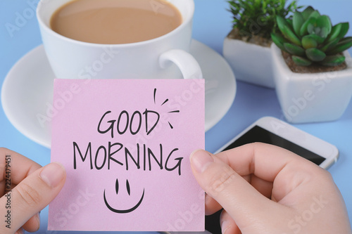 Konstfotografi Paper card with text good morning, cup of coffe and phone