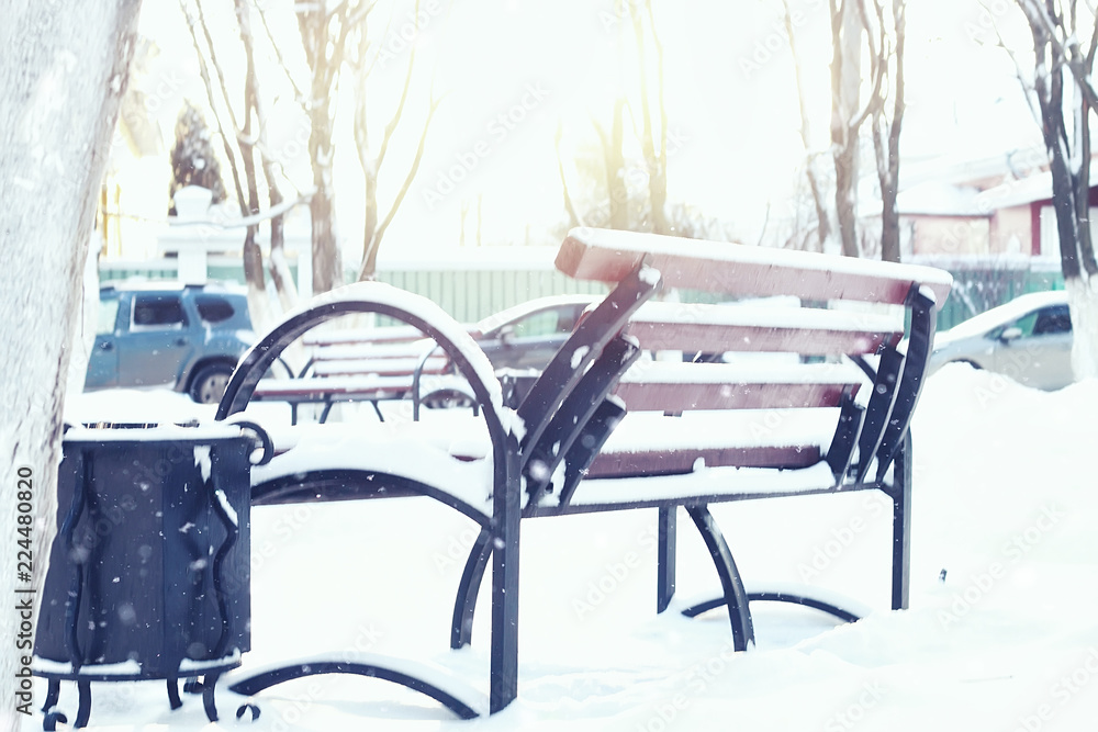 Winter street bench in city