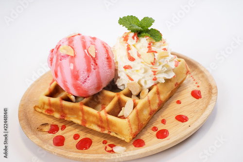 Homemade waffle with strawberry ice cream