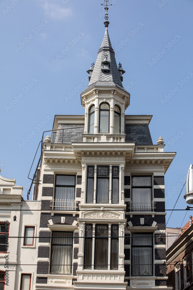  Typical gabled houses on Damrak street in Amsterdam, Holland, Netherlands