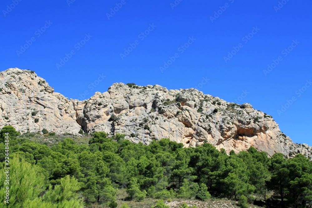 sandstone escarpment with cave