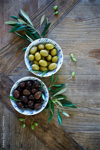 Fototapeta Naklejka Na Ścianę i Meble -  Mediterranean food background. Wooden table with olives