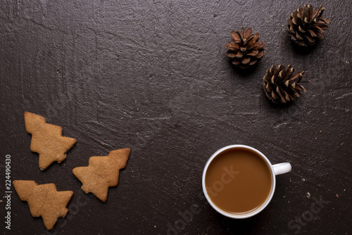 Coffee with cookies in shape of Christmas tree