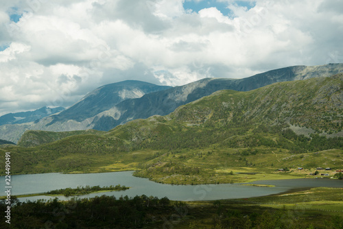 landscape view of river and mountains with overcasted sky, Hallingskarvet National park, Norway