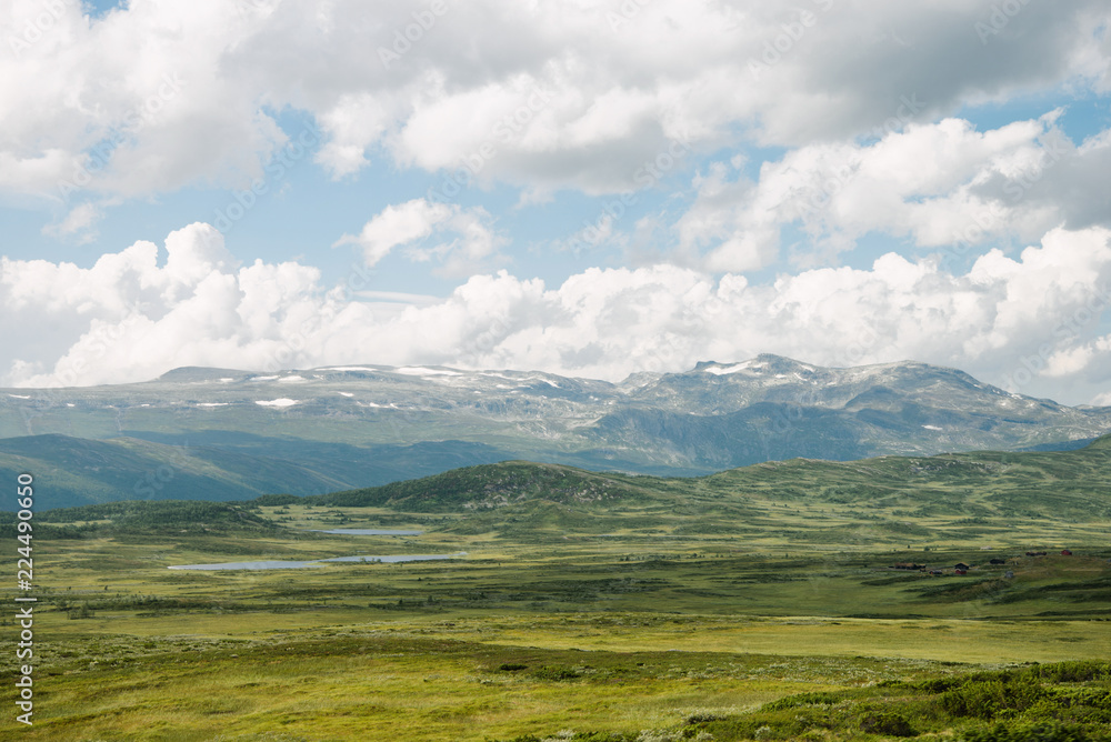 aerial view of green valley with mountains and cloudy sky, Hallingskarvet National park, Norway aerial view of green valley with mountains and cloudy sky, Hallingskarvet National park, Norway