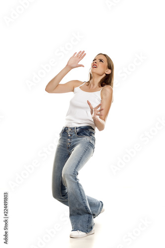 young pretty woman in deffence position on white background