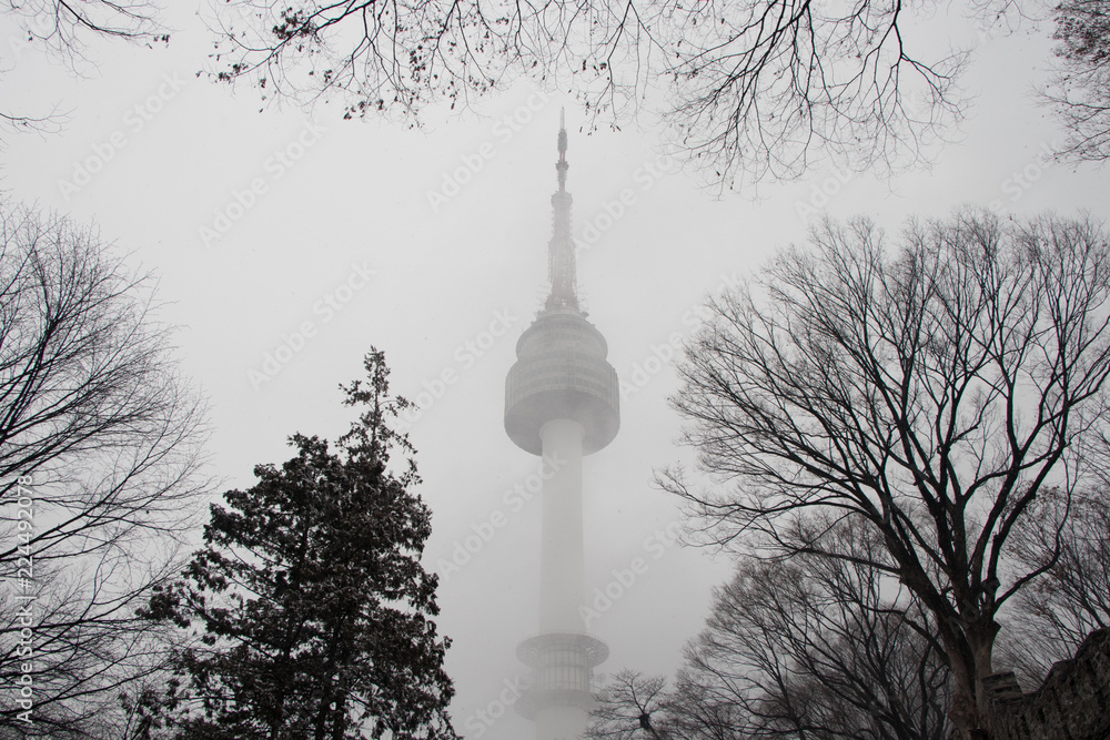 seoul tower, city in winter with snow stom, south korea. Seoul Tower ...