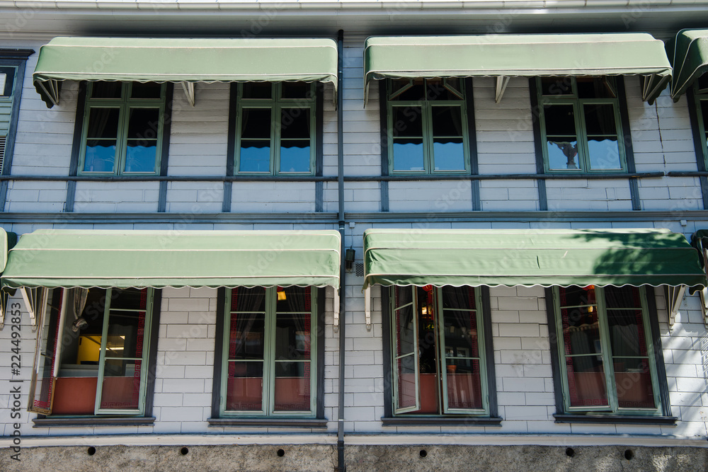 Obraz premium facade of buillding with windows in Lillehammer, Oppland, Norway