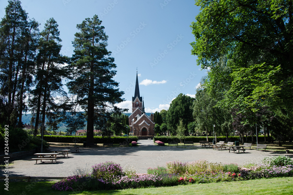 scenic view of park with trees and building in Lillehammer, Oppland, Norway