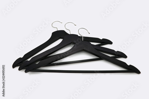 black clothes hangers on white background, isolated