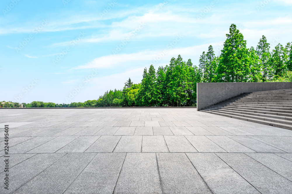 Empty city square floor and green woods scenery