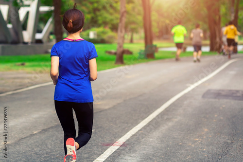 young lady running on the road