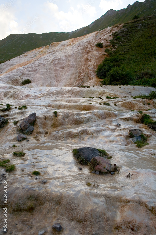 Water flows through the limestone slope of the mountain. Water flows through the limestone slope of the mountain.