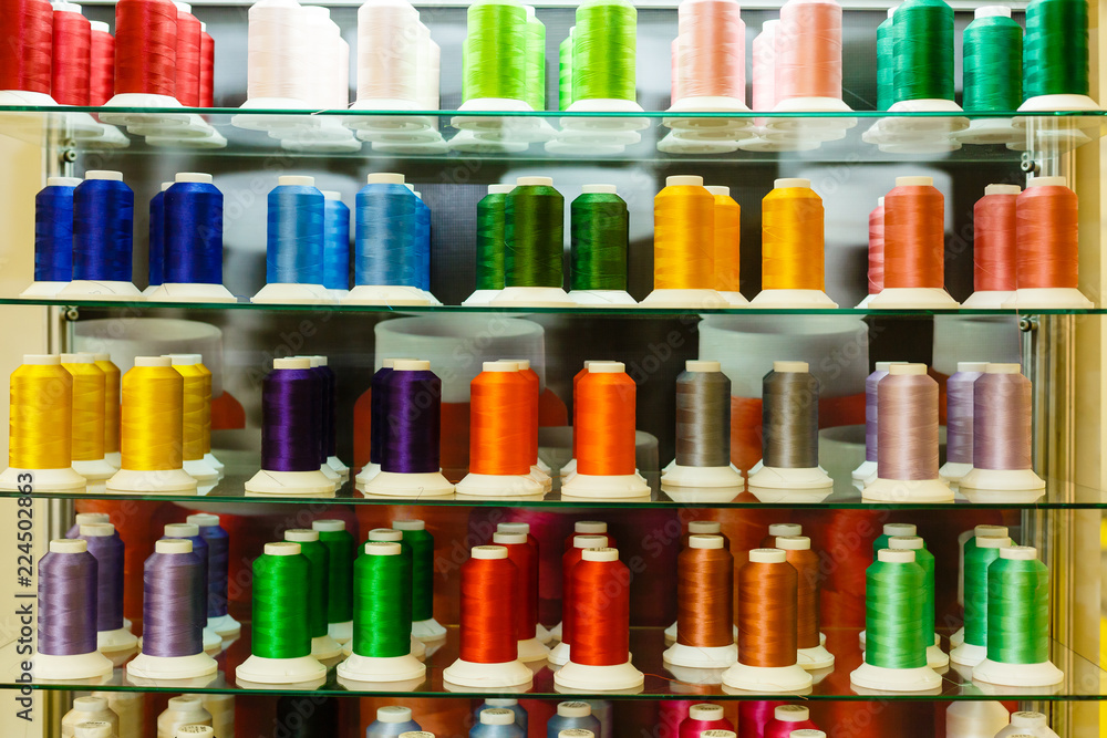 Rolls of colorful threads, close-up and top view. home set for clothes repair, colorful thread Rolls of colorful threads, close-up and top view. home set for clothes repair, colorful thread