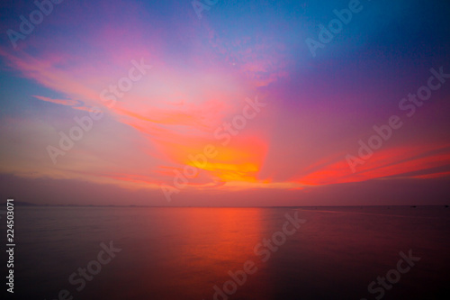 Twilight sky background. Colorful Sunset sky and cloud.vivid sky in twilight time background.Fiery orange sunset sky. Beautiful © kanpisut