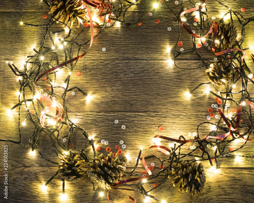 Christmas Light or Garland Lights on Wood Background photo