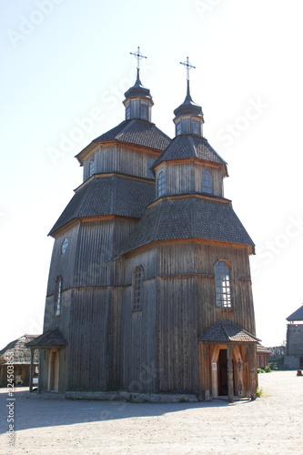 Wooden church. Wooden temple of Cossacks. Buildings on Zaporozhskaya Sich on island of Khortitsa in Ukraine. Medieval way of life