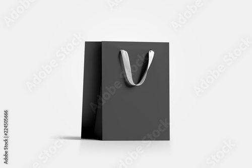 Blank black paper gift bag with white silk handle mockup, 3d rendering. Empty craft carry packet mock up, isolated. Clean shop bagful, side view. Beautiful package for present and shopping