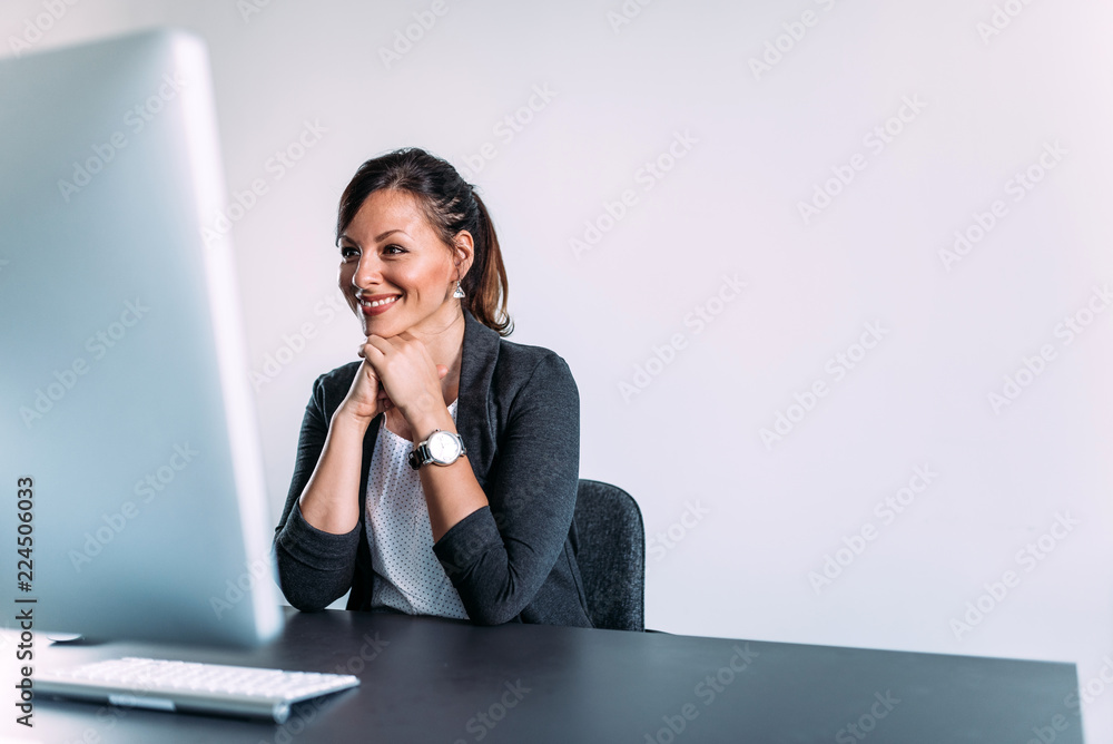 Happy woman looking at computer screen. Copy space. Happy woman looking at computer screen. Copy space.