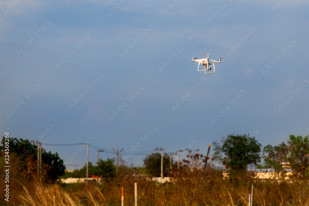 uav drone copter flying with digital camera.Drone with high resolution digital camera. Flying camera take a photo and video at thailand. uav drone copter flying with digital camera.Drone with high resolution digital camera. Flying camera take a photo and video at thailand.
