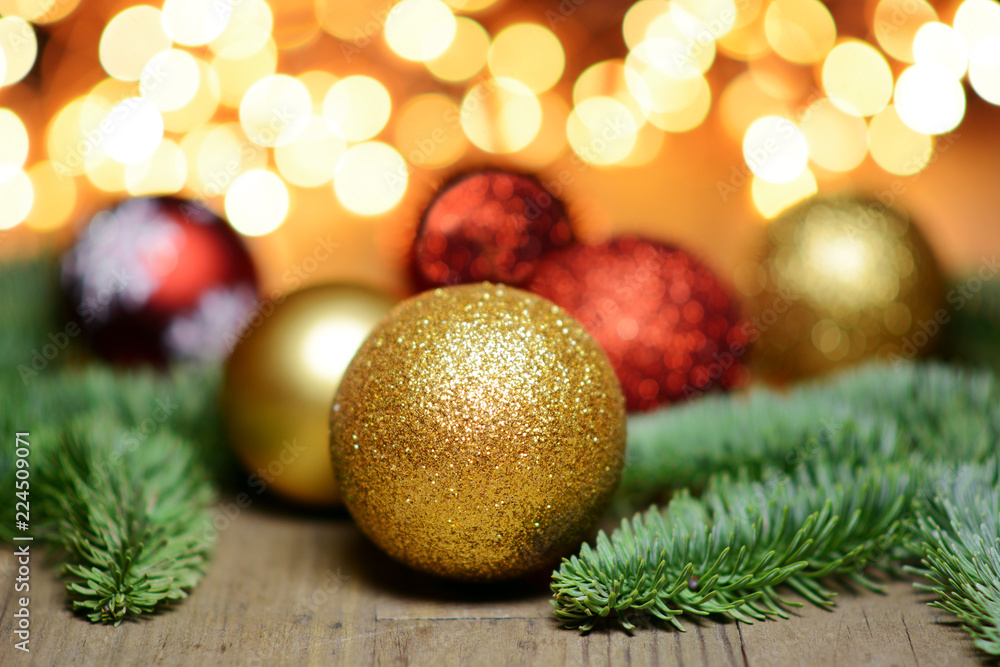 Christmas baubles and fir branches on as decoration for Christmas with fairy lights as decoration and lighting Christmas baubles and fir branches on as decoration for Christmas with fairy lights as decoration and lighting