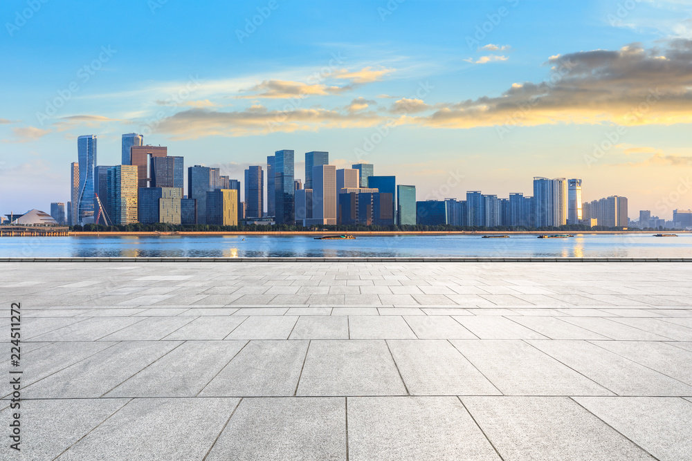 City square floor and modern buildings in hangzhou at sunrise