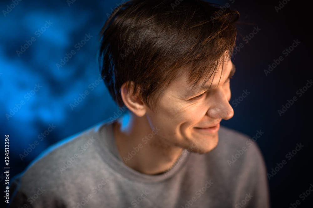 portrait emotional young man on blue background portrait emotional young man on blue background