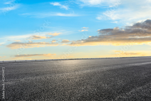 Clean asphalt highway and beautiful sky clouds at sunset © ABCDstock