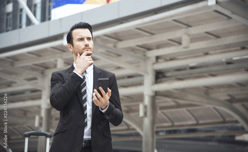 Handsome businessman using mobile phone. concept communication. Handsome businessman using mobile phone. concept communication.