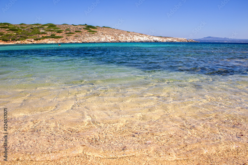 Idyllic beach with white sand and  blue waters
