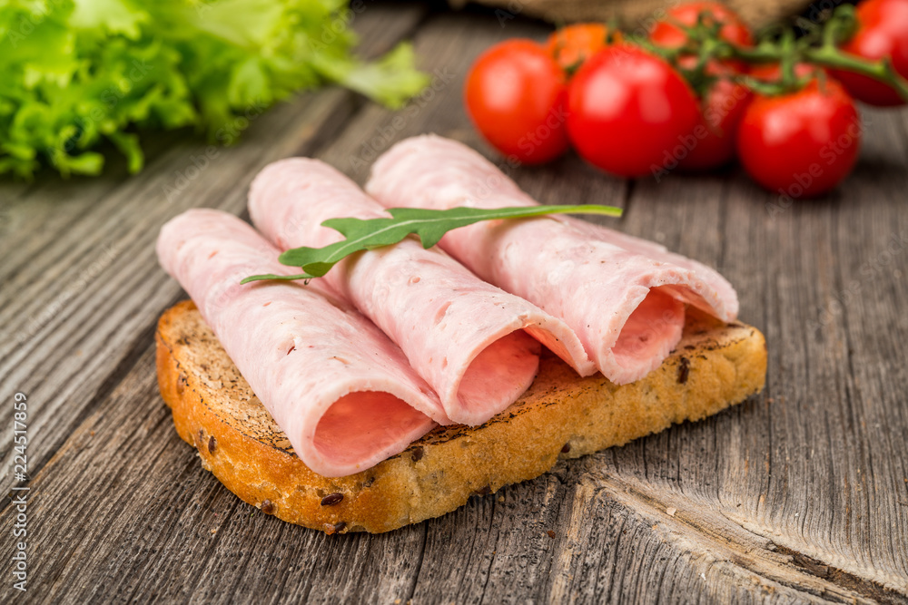 sandwich with ham and vegetables. Organic products sandwich with ham and vegetables. Organic products
