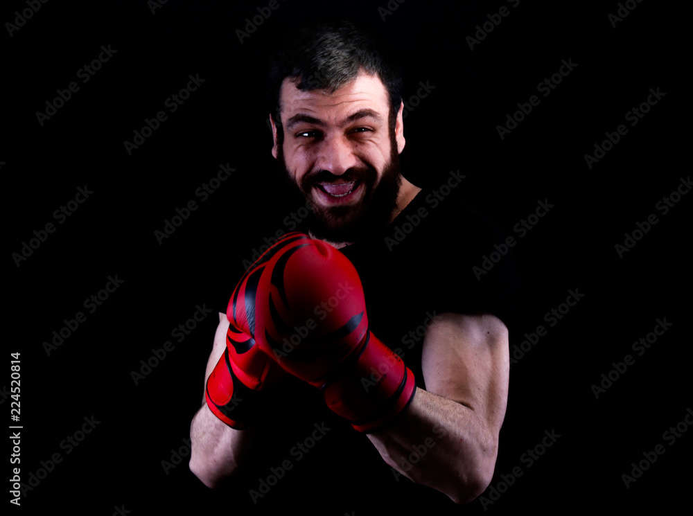 Portrait of smiling man wearing boxing gloves