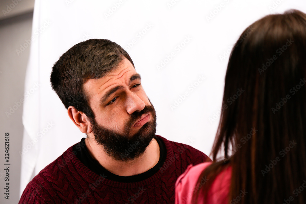 Fototapeta premium man very regretful; apologizes to the woman